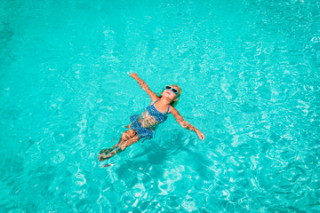 little girl relax in water on beach or pool, vacation