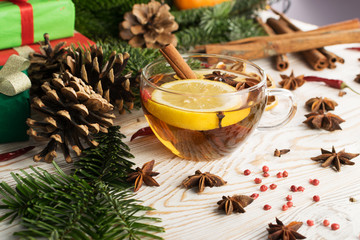 Hot winter drink with spices on festive new year background