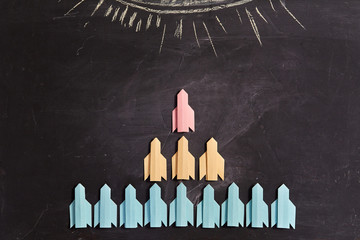 Business structure or corporate subordination, hierarchy and career: Pyramid of paper rockets