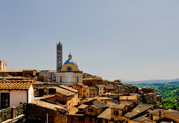 Fototapeta na wymiar View of the roofs of Siena, Tuscany with the town's cathedral