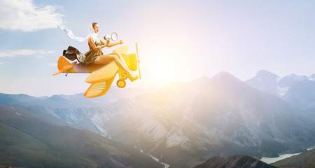 Woman in retro airplane . Mixed media