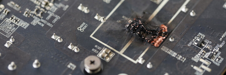 Closeup view of damaged graphic adapter burnt out after hack attack