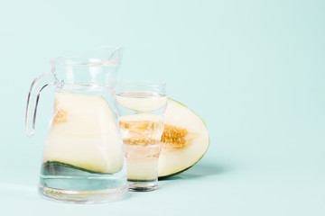 Half of melon with jug full of water