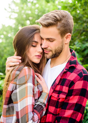Fototapeta premium Enjoying intimacy. Cuddling with darling. Man hipster and pretty woman in love. Summer vacation. Fall in love. Pure feelings. Romantic date concept. Beautiful people. Happy together. Couple in love