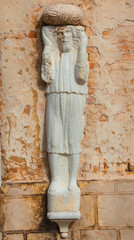 Moorish merchant with turban ancient medieval statue located in Campo dei Mori (Moors Square) in the historic center of Venice (13th century, author unknown)