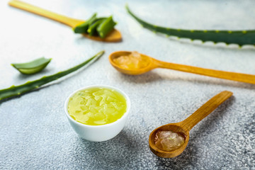 Minimalistic composition of sliced aloe vera leaves, for making moisturizing skincare gel. Organic home made cosmetics concept. Close up, copy space, top view, flat lay.