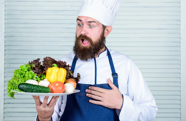 Vegetarian salad with fresh vegetables. Healthy food cooking. Mature hipster with beard. surprised bearded man. chef recipe. Dieting organic food. Cuisine culinary. Vitamin. Daily task