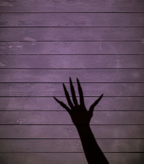 witch hand shadow, purple halloween background