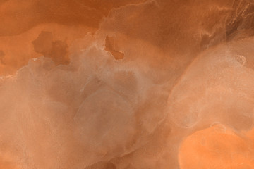 Hand painted alcohol ink background. Abstract delicate orange texture. Contemporary autumn wallpaper. 