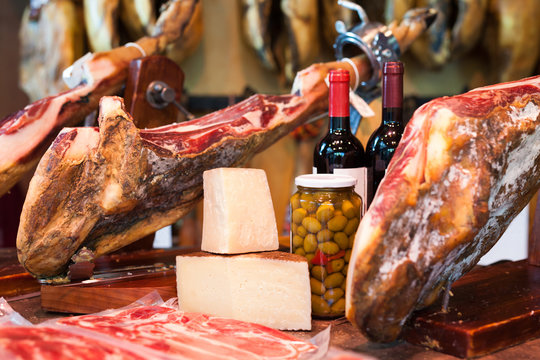 jerked iberic jammon of bacon with wine, cheese and olives