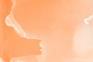 Hand painted alcohol ink background. Abstract delicate orange texture. Contemporary autumn wallpaper. 