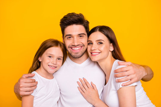 Closeup photo of three family members hugging happy together wear casual outfit isolated yellow background