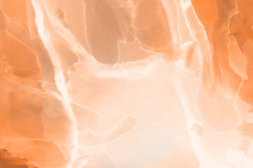 Hand painted alcohol ink background. Abstract delicate orange texture. Contemporary autumn wallpaper. 