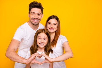 Photo of daddy mommy and small foxy lady making heart figure with hands wear casual outfit isolated yellow background