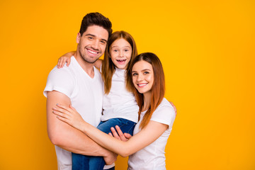 Portrait of three nice attractive charming cute winsome lovely cheerful cheery person spending weekend cuddling isolated over bright vivid shine yellow background