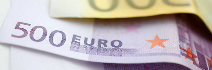 Paper euro 500 and 200 cash lie on the table closeup. Currency credit concept.