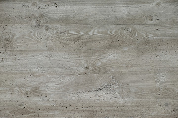 Concrete surface with wooden planks texture, with a pronounced element