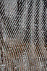 Abstract background. A sheet of rusty metal with a hemisphere pattern.