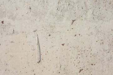 Light concrete surface with flaws
