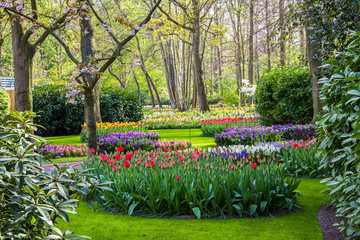 Keukenhof, Lisse, Netherlands - 18 April 2019: The view of different corners of the Keukenhof park, the worlds largest flower and tulip garden park in Holland. One of the most popular destination