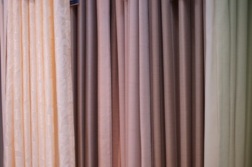 Obraz premium Choosing a curtain at a furniture store