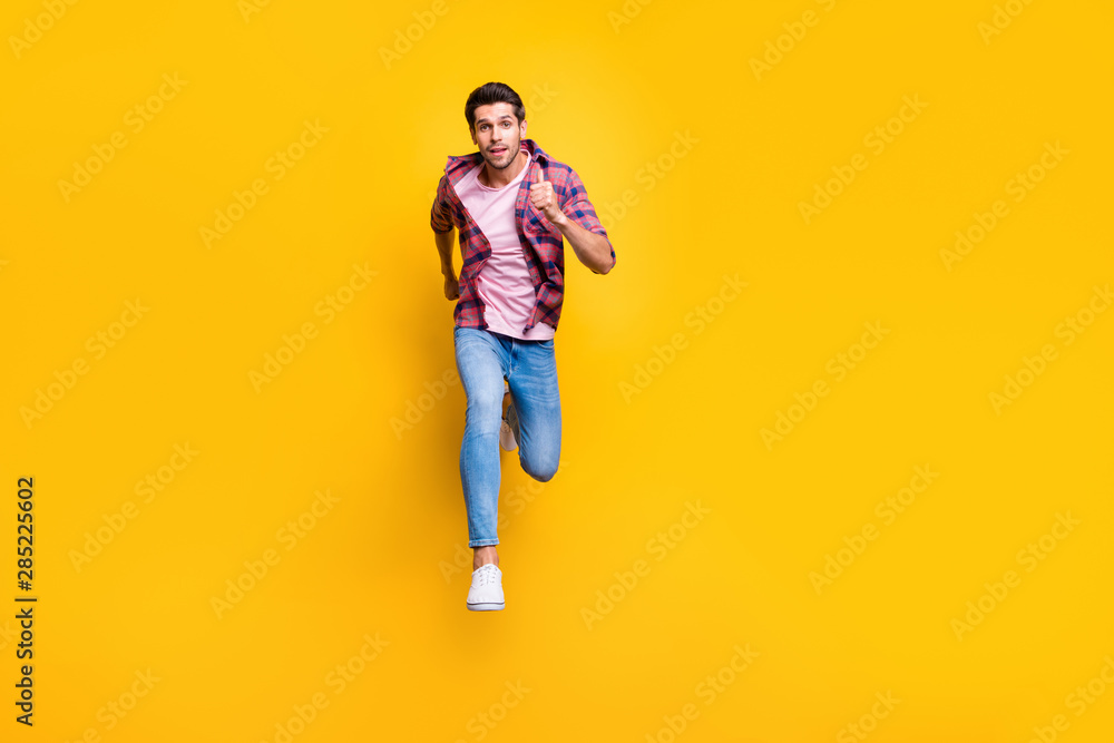 Poster full length body size photo of serious running man looking at camera moving towards it while isolate