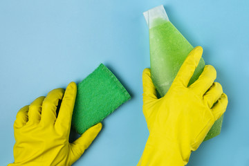 Close-up person cleaning up with sponge