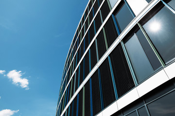 Fototapeta na wymiar Modern glass Business office or residential apartment building in city suburbans