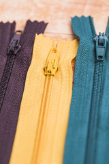 Line of three different zips