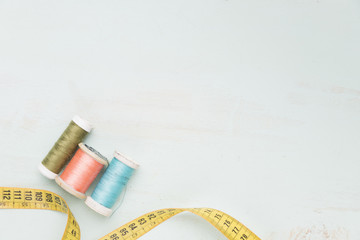 Reels of yarn and measuring tape