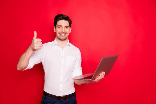 Photo Of Man Thumbing Up With Laptop In His Second Hand Finishing His Work While Isolated With Red Background