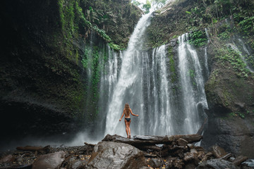 Air Terjun Tiu Kelep waterfall near Rinjani, Senaru, Lombok, Indonesia, Southeast Asia. Back view...