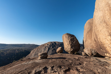 Fototapeta na wymiar Huge boulders balance perfectly on Pyramid Rock on a clear and sunny day in Girraween NP, Queensland, Australia
