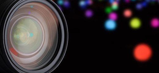 DSLR Camera Lens Isolated. Closeup Reflections in Lens. Blurred Background and Abstract Bokeh.