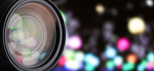 DSLR Camera Lens Isolated. Closeup Reflections in Lens. Blurred Background and Abstract Bokeh.