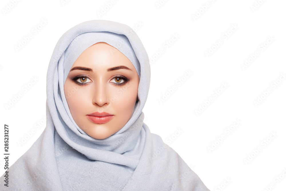 Wall mural portrait of young woman in turban. studio. - image