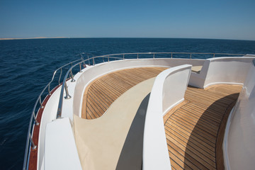 View over the bow over a large motor yacht