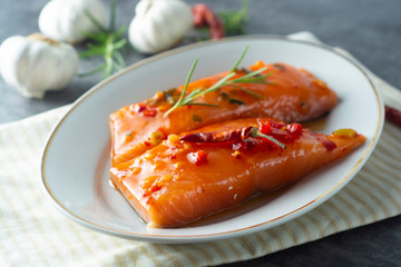 Marinated slices of salmon fillet. Cooking healthy food. Sea food.