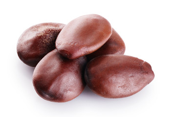 Carob bean seeds  isolated on white background.