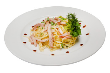 Stir-fried noodles, mixed greens in white sauce on a white isolated background