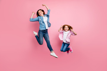 Full size photo of foxy little lady and her excited mom jumping high wear casual clothes isolated...