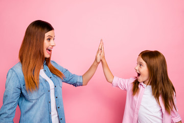 Profile side photo of cheerful people with long hair clapping hands screaming yeah wearing denim...