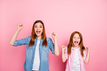 Pretty foxy little lady and her mom celebrating lottery win wear casual jeans clothes isolated pink...