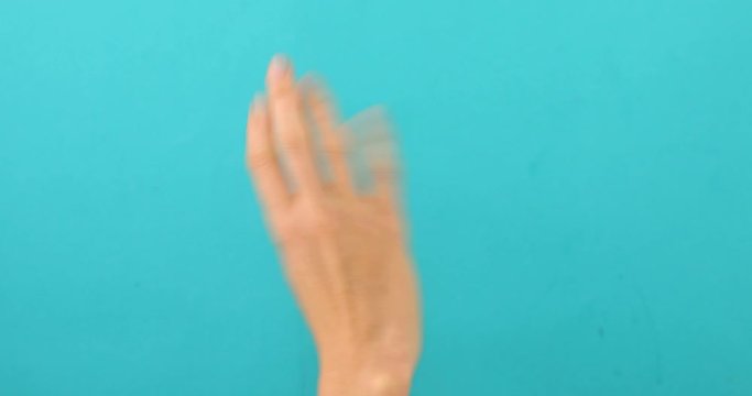 Closeup of isolated on blue adult female hand counting from 0 to 5. Woman shows fist fist, then one, two, three, four, five fingers