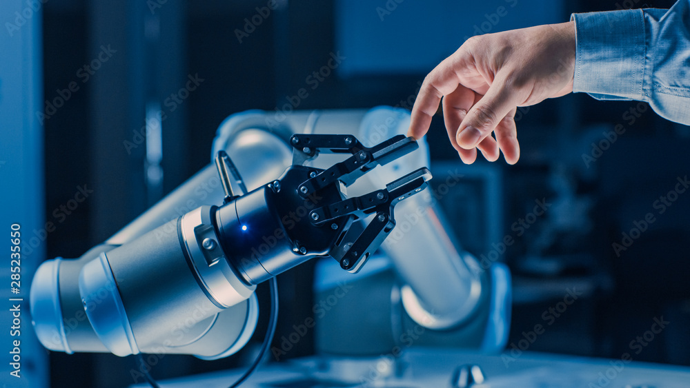 Aufkleber futuristic robot arm touches human hand in humanity and artificial intelligence unifying gesture. co