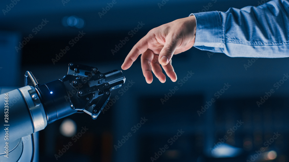 Poster futuristic robot arm touches human hand in humanity and artificial intelligence unifying gesture. co