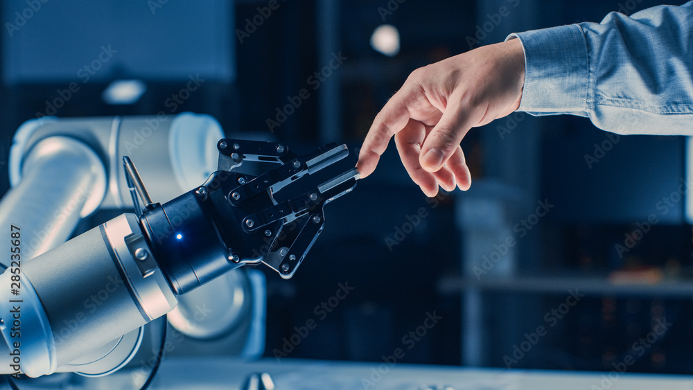 Poster futuristic robot arm touches human hand in humanity and artificial intelligence unifying gesture. co