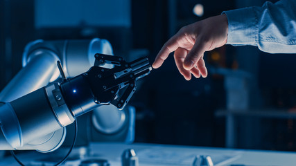 Futuristic Robot Arm Touches Human Hand in Humanity and Artificial Intelligence Unifying Gesture. Conscious Technology Meets Humanity. Concept Inspired by Michelangelo's Creation of Adam - obrazy, fototapety, plakaty