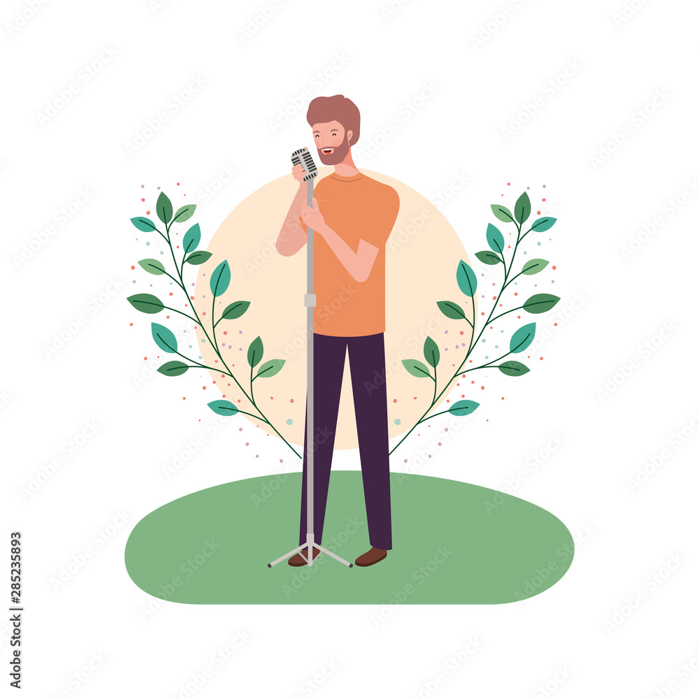 Wall mural man with microphone and branches and leaves in the background