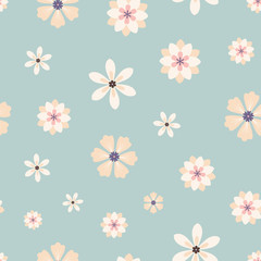 Seamless pattern of cream flowers on a blue background.